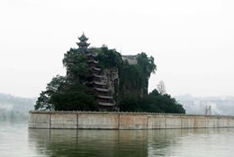 On the river side of the hill is a red pavilion of nine floors which leans against the side of the hill providing a walkway to the temple at the top of the hill.