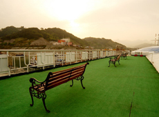 Doing exercises or enjoying dawn on the sun deck