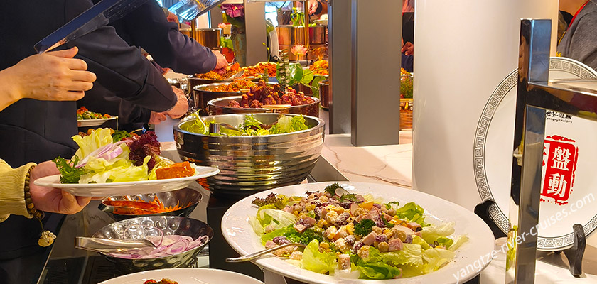 Enjoy a Rich Chinese and Western Buffet Dinner Onboard